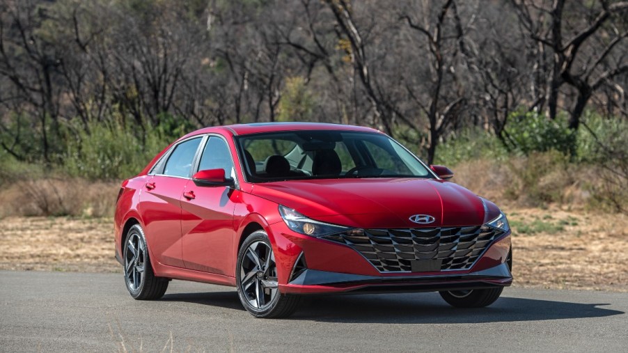 a red hyundai elantra parked with the high end features and technology you want