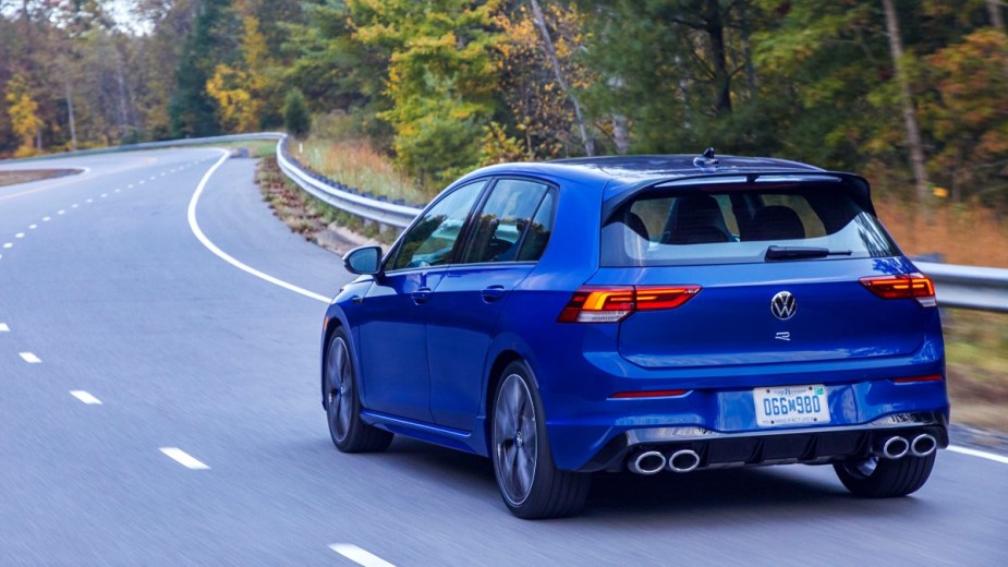 the blue 2022 volkswagen golf r tackles a road with confidence helping it retain its resale value