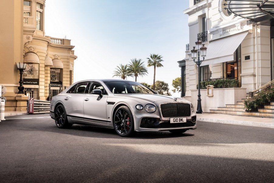 A silver-gray 2023 Bentley Flying Spur S in a European city square