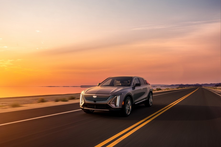 A gray 2023 Cadillac Lyriq driving down a highway. How are some buyers getting a secret discount?