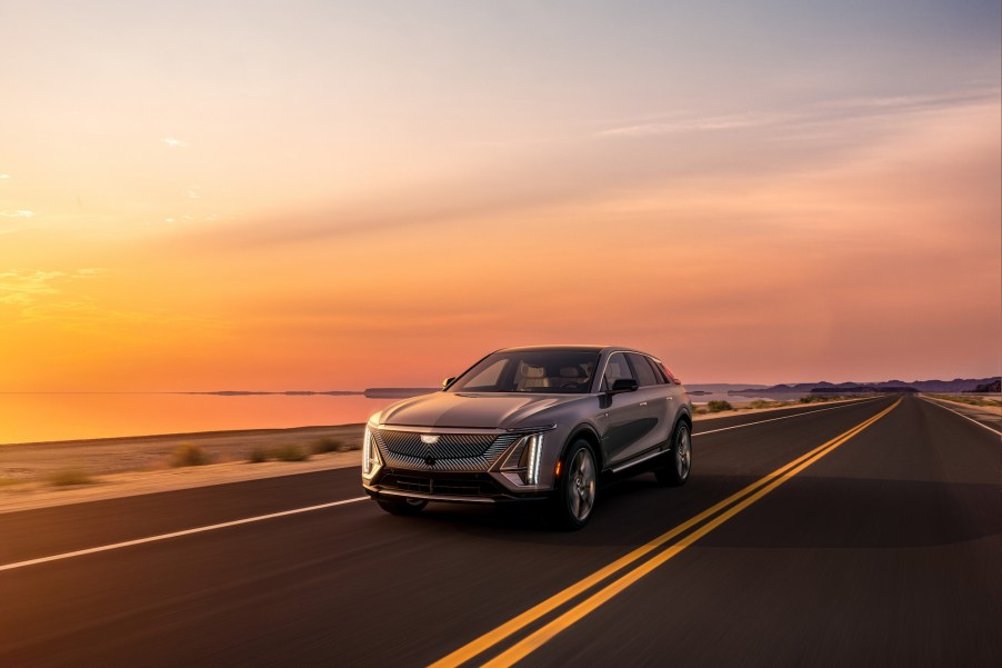 A gray 2023 Cadillac Lyriq driving down a highway.