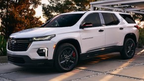 A white 2023 Chevrolet Traverse midsize SUV is parked.