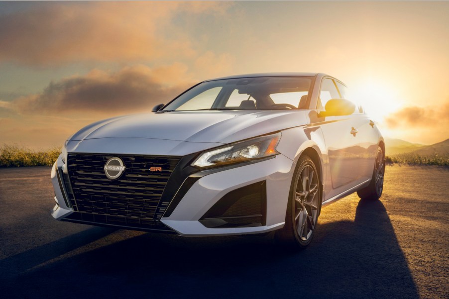 2023 Nissan Altima in white shining at dusk