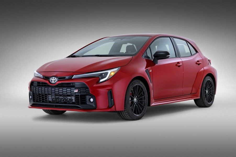 A red 2023 Toyota GR Corolla Core in a gray studio