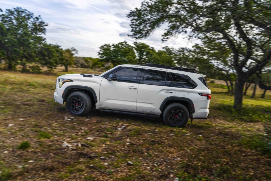 White Toyota Sequoia 4x4 SUV off-roading through the woods. Are there more Toyota easter eggs yet to be found? 