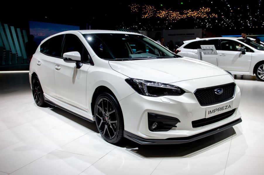 White Subaru Impreza hatchback at an auto showThe S