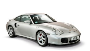 A silver 996 Porsche 911 Turbo Coupe in a white studio