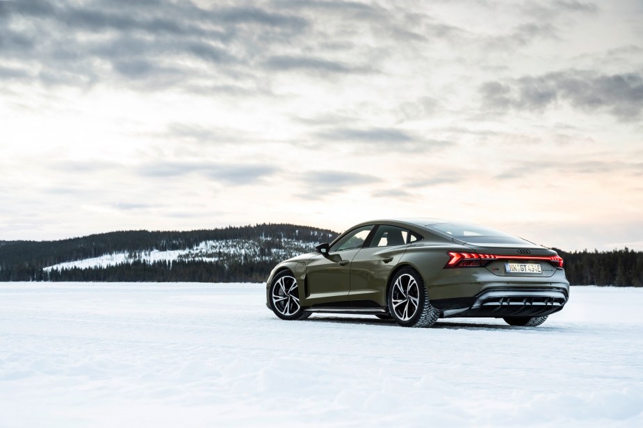 The Audi e-tron GT, pictured here in the snow, is comparable to the BMW i4 and the Ford Mustang Mach-E GT.