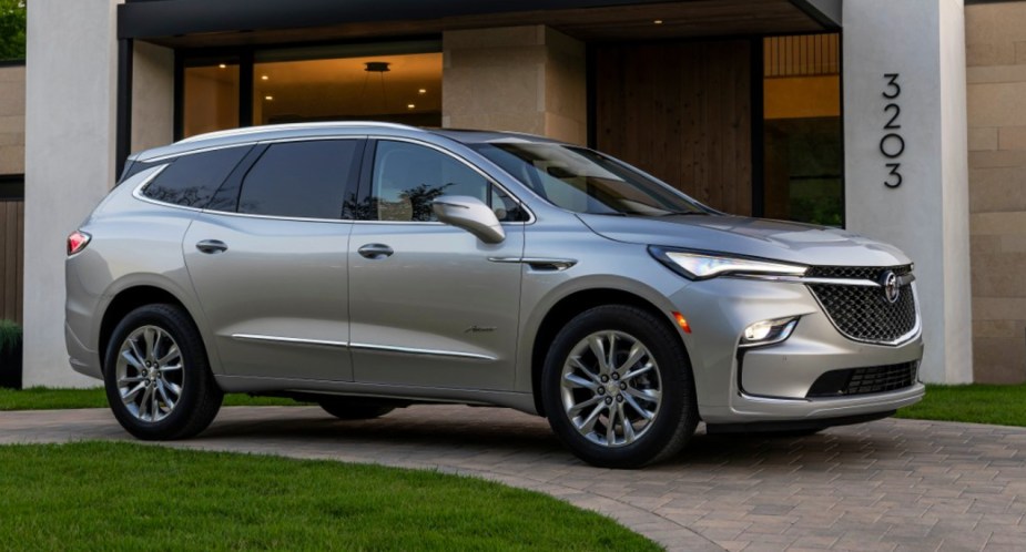 A gray Buick Enclave midsize SUV is parked outdoors. 