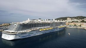 A large cruise ship sailing across the water.