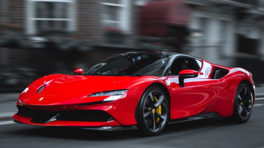 a red ferrari sf90 stradale, a stunning plug in hybrid that is a pleasure to drive