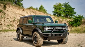 A green 2022 Ford Bronco, potentially with the Sasquatch package, parked outdoors.