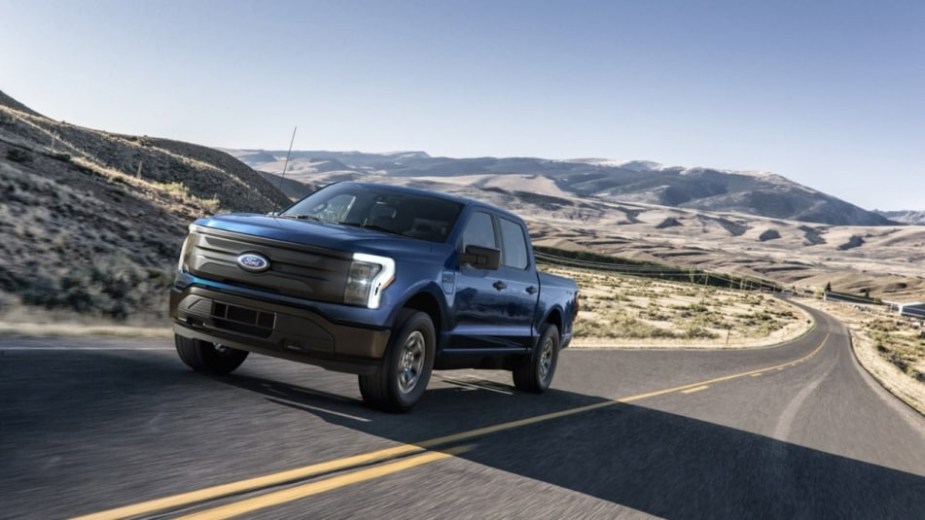 a blue Ford Lighting Pro on a road