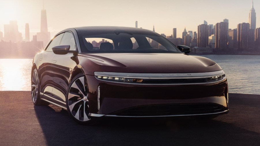 Front view of maroon 2022 Lucid Air, the only electric car that has over 500 miles of driving range