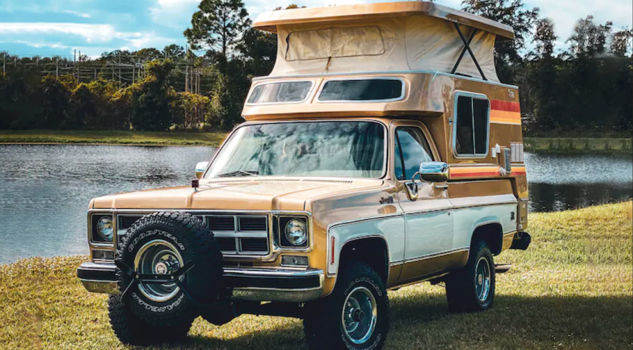 GMC Jimmy Casa Grande parked next to some water