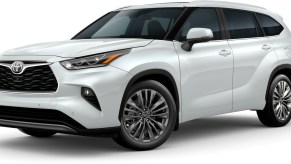 A white 2022 Toyota Highlander Platinum against a white background.