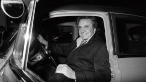 Johnny Cash driving in a 1950 Pontiac, seen at the Dublin Airpot in Ireland