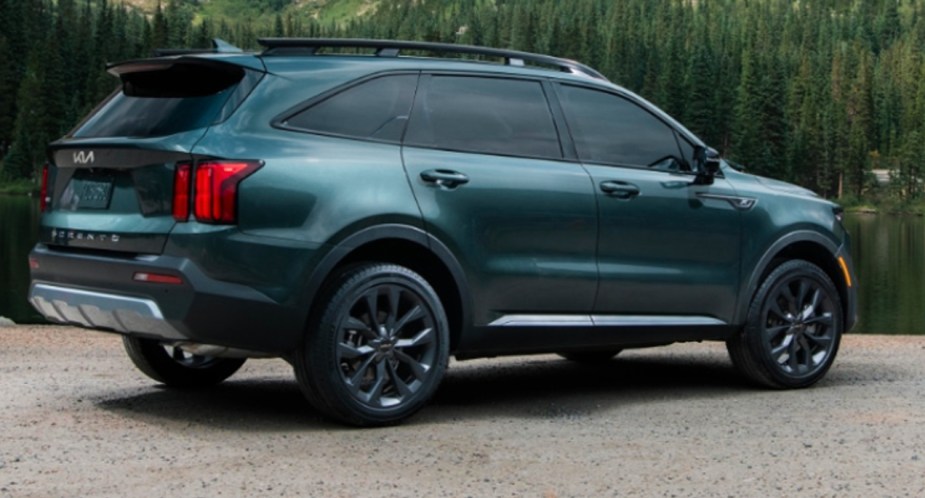 A green 2022 Kia Sorento SUV is parked outdoors. 