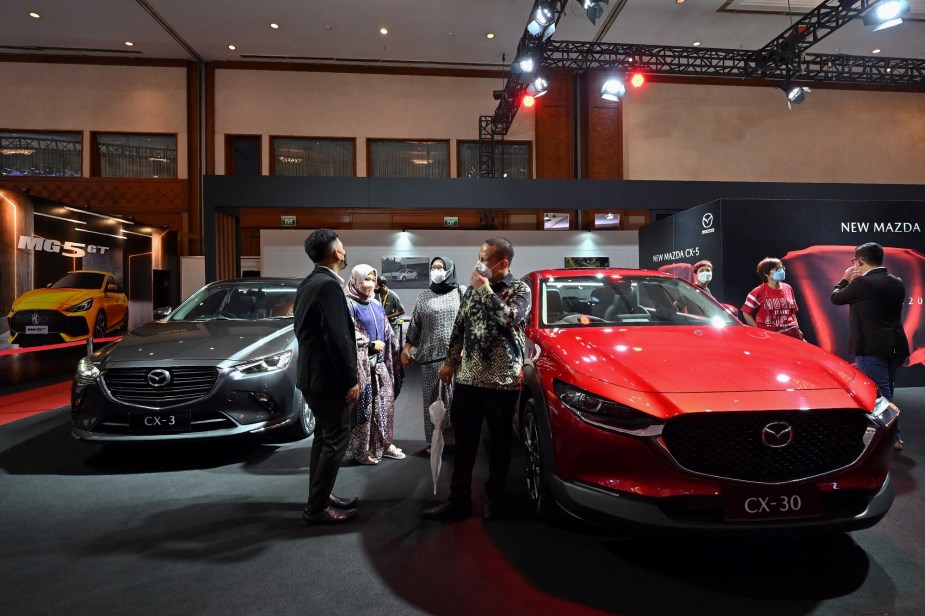 The Mazda CX-30, pictured here in red, is one of the cheapest cars to insure.