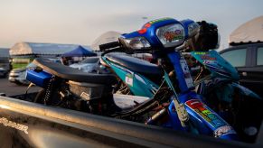 A motorcycle in the back of a truck bed.