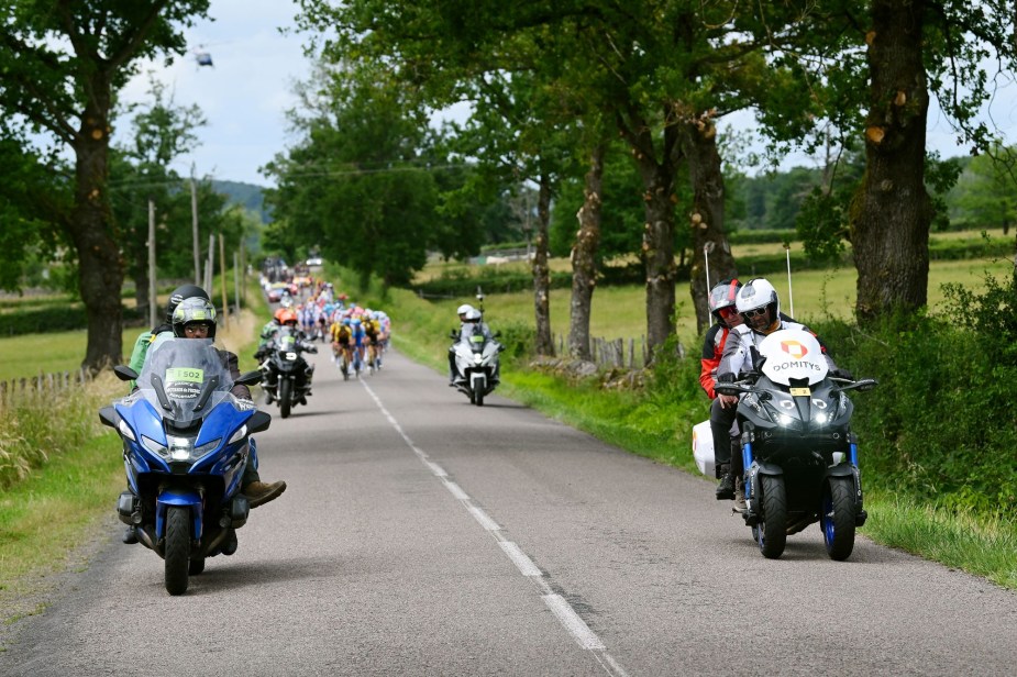 A group of motorcycles riding burn calories on a highway. 