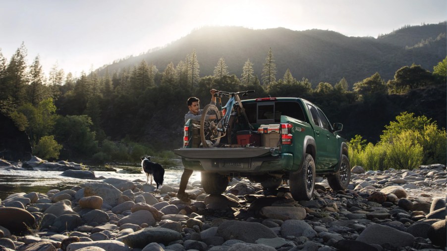 A 2022 Nissan Frontier has gear loaded into its bed.