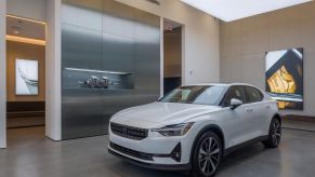 A Polestar 2 electric vehicle (EV) parked in a retail space in Manhattan, New York City