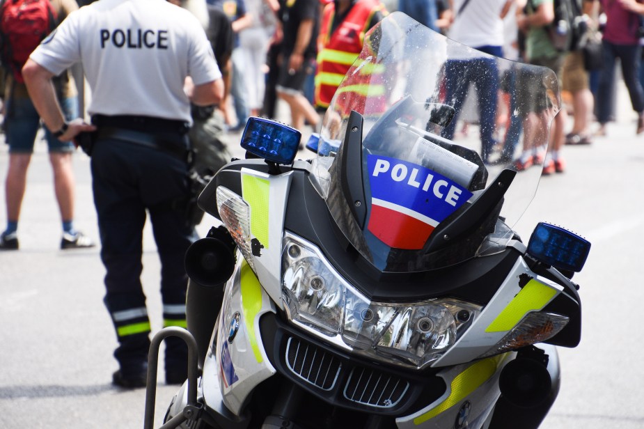 A police motorcycle parked outdoors. 