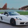 A white Porsche 718 Boxster S luxury roadster coupe convertible model