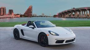 A white Porsche 718 Boxster S luxury roadster coupe convertible model