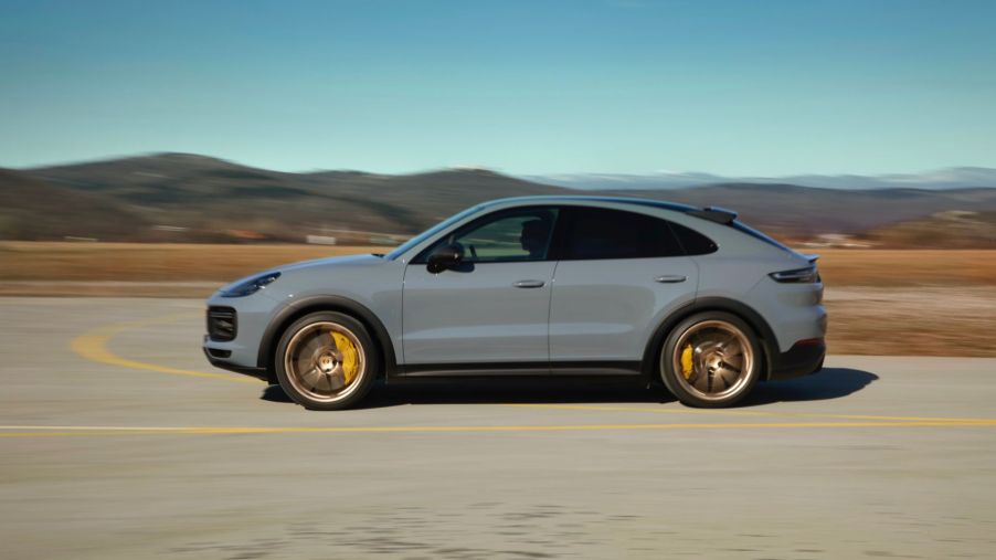 a gray Porsche Cayenne driving