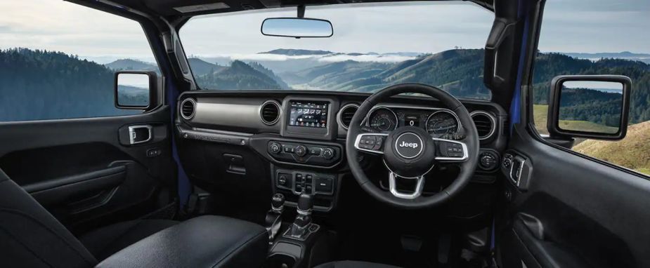 The interior of a right-hand drive Jeep Wrangler.