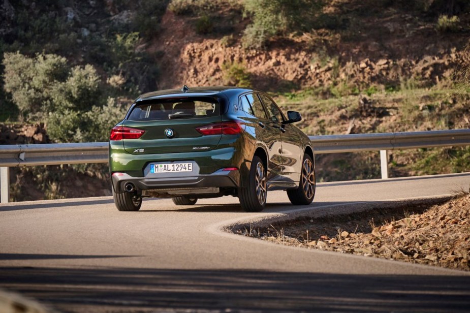 Rear angle view of green 2023 BMW X2, highlighting its release date and price