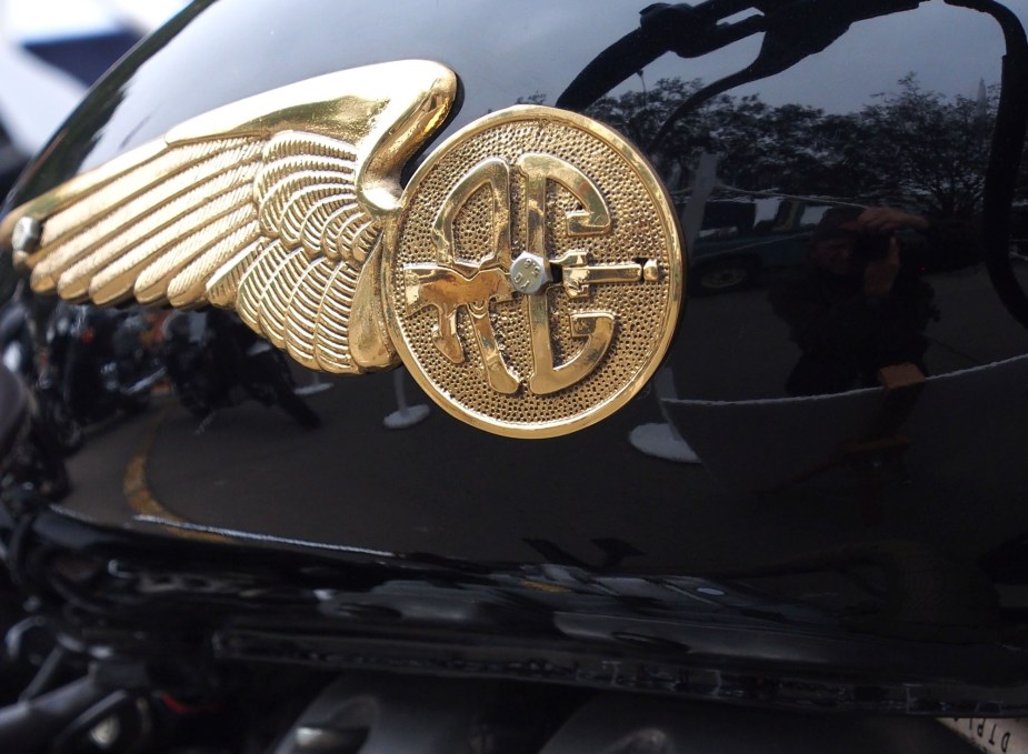 A Royal Enfield logo on a black tank. The longest running motorcycle. 