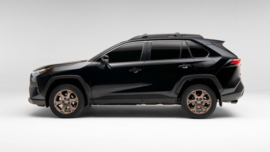 Side view of Midnight Black Metallic 2023 Toyota RAV4