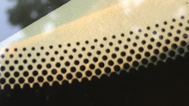 Why Does a Car Windshield Have Small Black Dots?