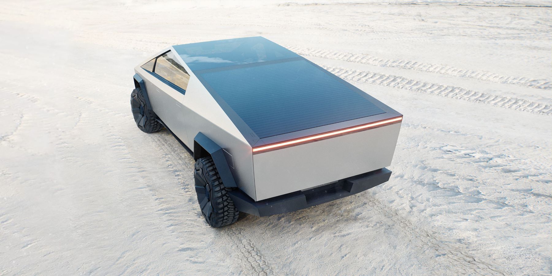 A rear shot of the Tesla Cybertruck's closed bed with the electric truck parked on a white sandy beach