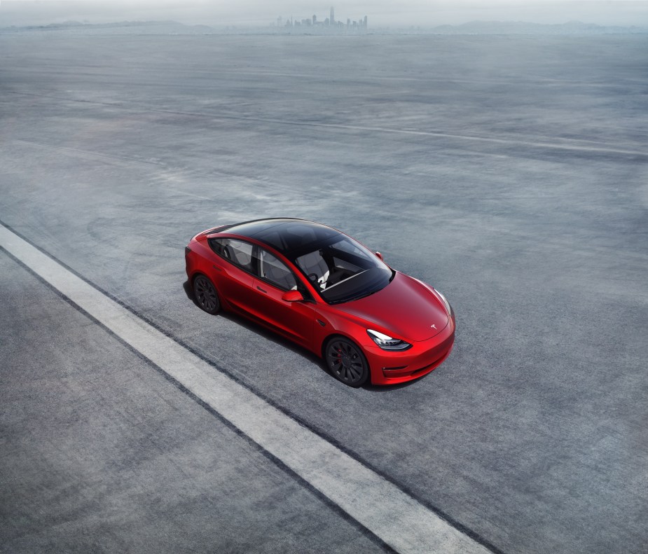 The Tesla Model 3 shows off its glass roof, which doesn't open.