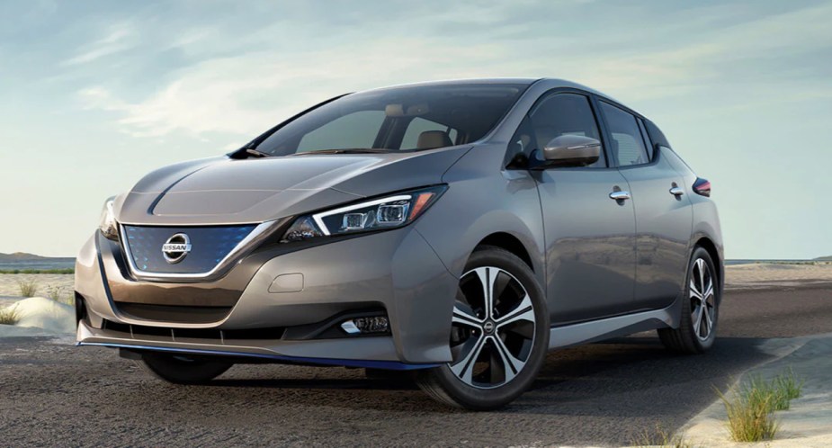 A gray 2022 Nissan Leaf electric car is parked. 