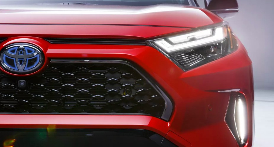 A red 2022 Toyota RAV4 Prime plug-in hybrid SUV. 