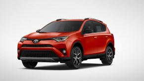 A red 2016 Toyota RAV4 crossover SUV.