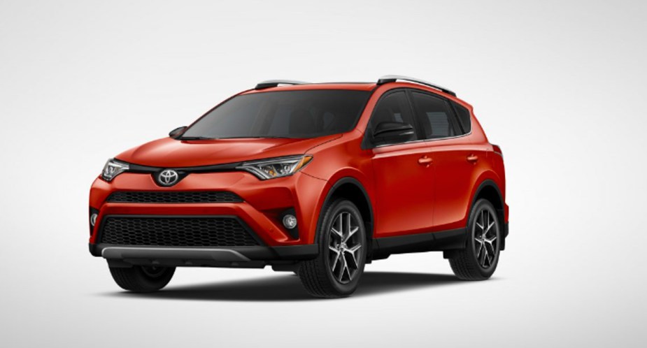 A red 2016 Toyota RAV4 crossover SUV. 