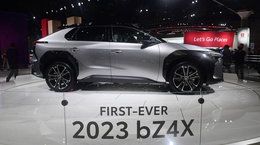 A silver 2023 Toyota bZ4X parked indoors.