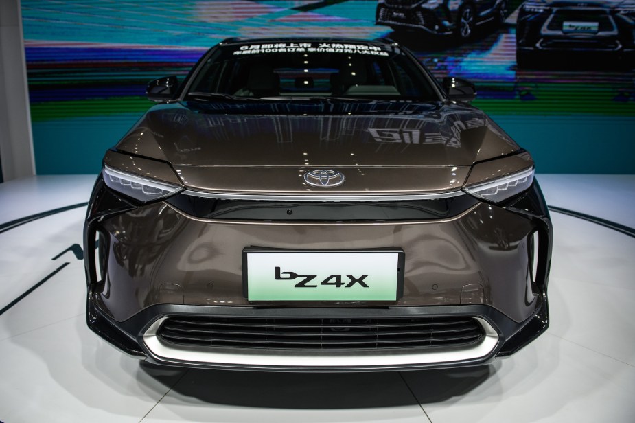 A grey Toyota bZ4X parked indoors. 