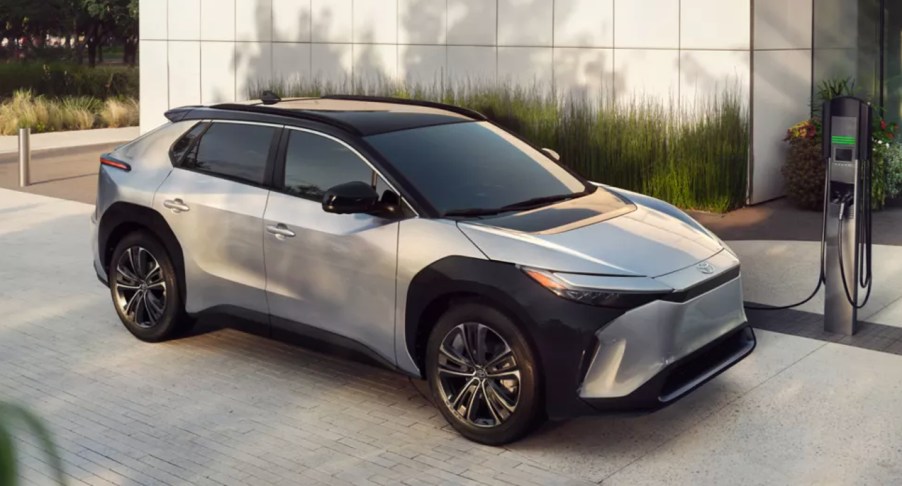 A gray 2023 Toyota bZ4X electric SUV is charging.