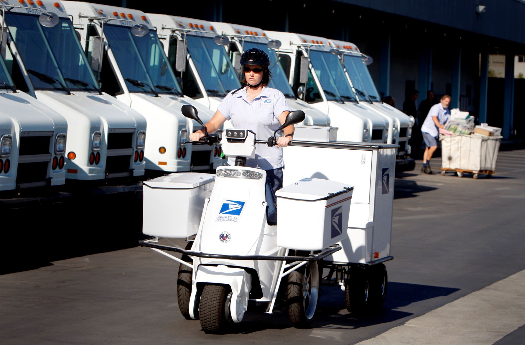 A USPS T-3 Motion electric-powered three-wheeler bike being tested by Dana Grasman for range and performance