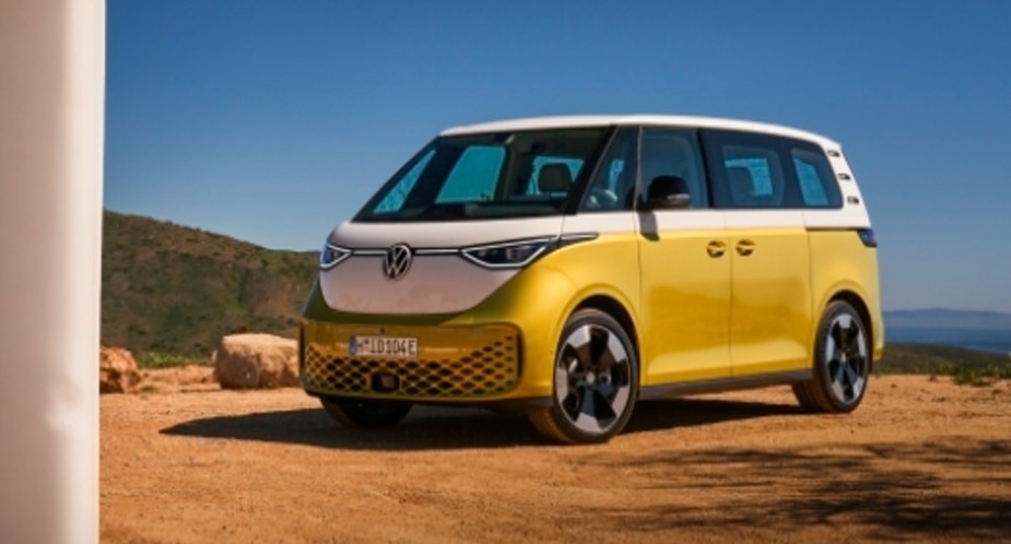 A white and green 2024 Volkswagen ID.Buzz electric bus is parked outdoors. 