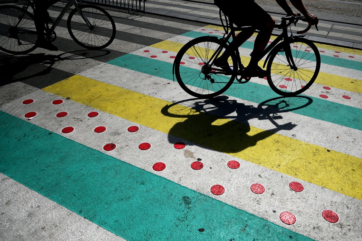 A bicycle rolling across a crosswalk