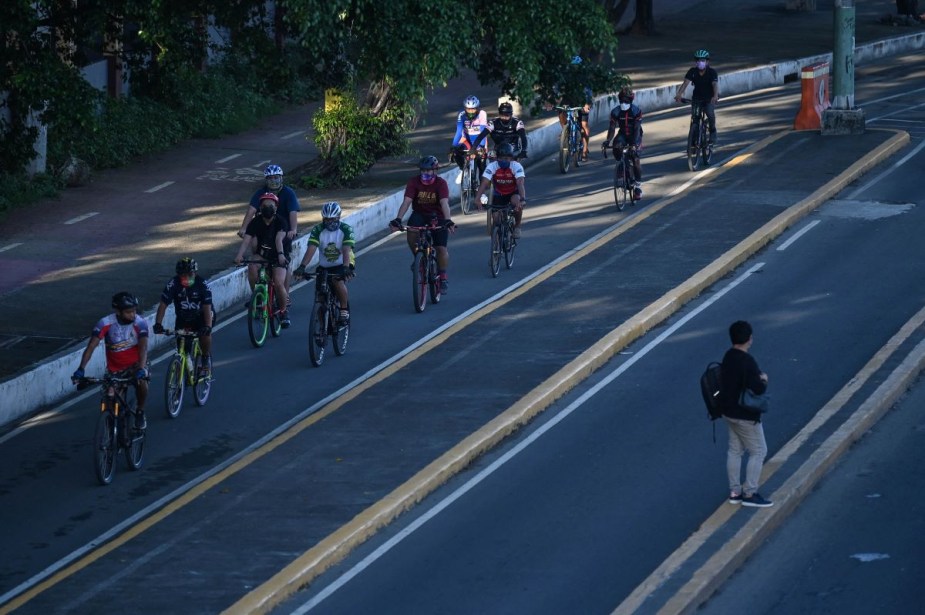 Cyclists riding in a protected bike lane