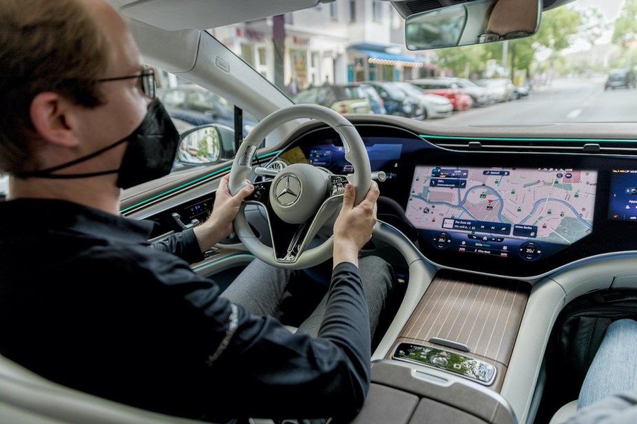 A man drives a 2022 Mercedes-Benz EQS